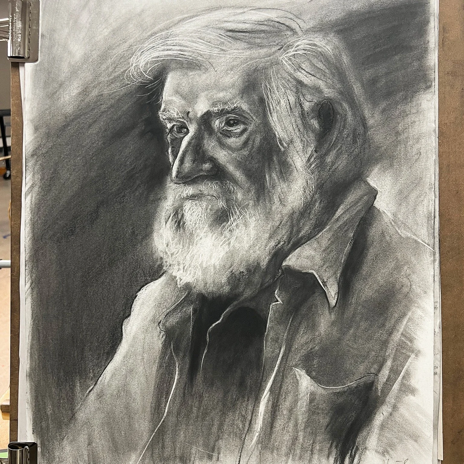 Expressive charcoal portrait of an older man